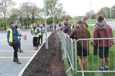 Students wait for the Queen